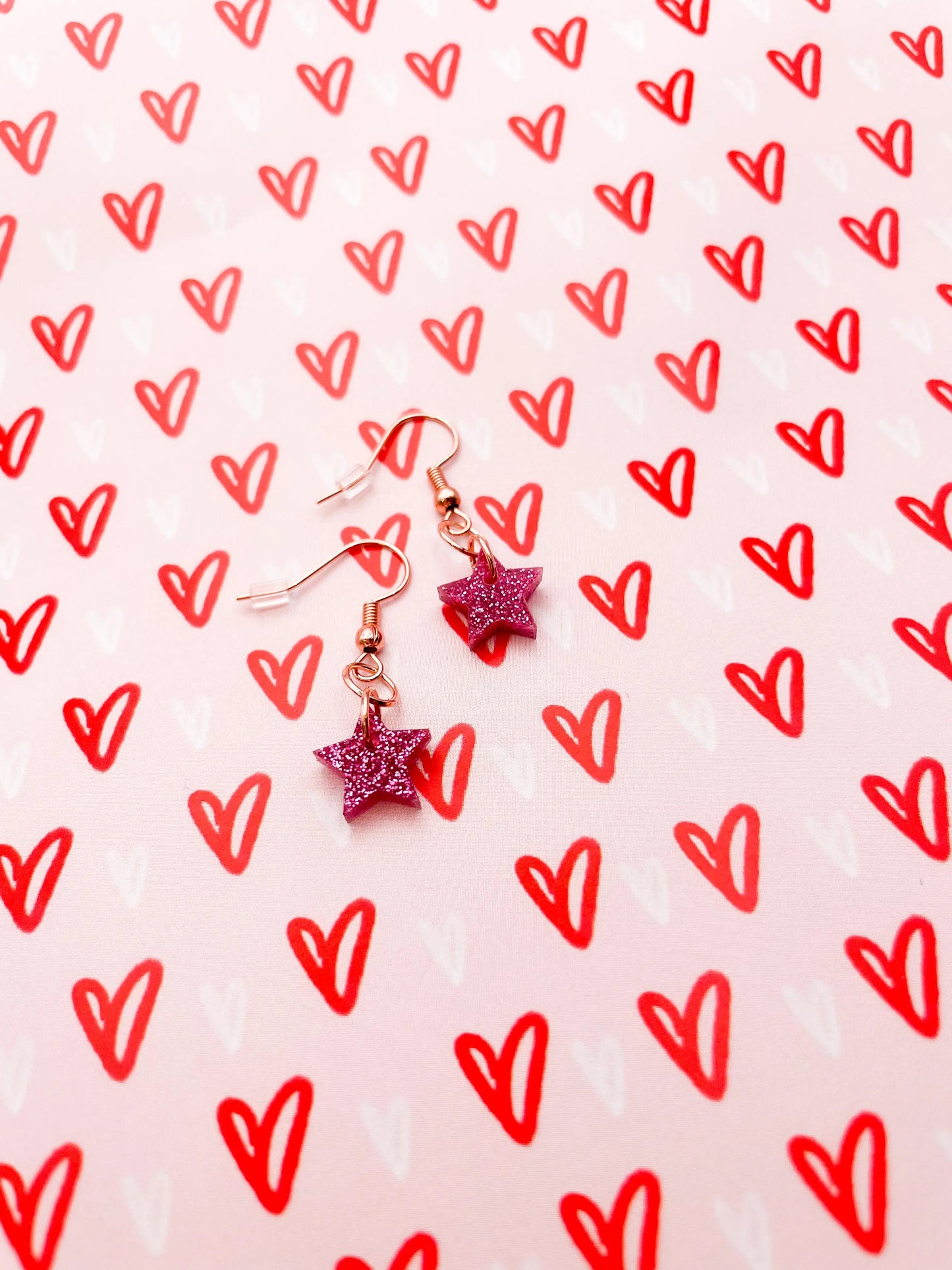 Mini Pink Glitter Acrylic Star Dangle Earrings from Sapphire Frills